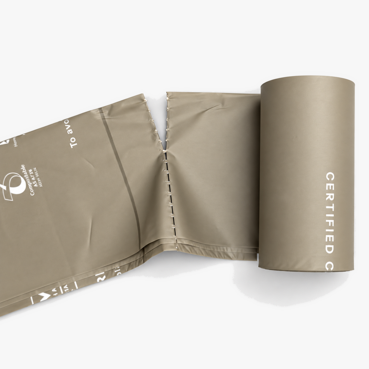 Close-up of a perforated ROAM poo bag roll